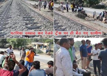 villagers sitting on railway track in udaipur for thier demands