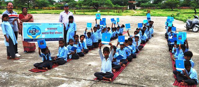 Rajasthan samaj sava sansthan udaipur copy distribution in government schools